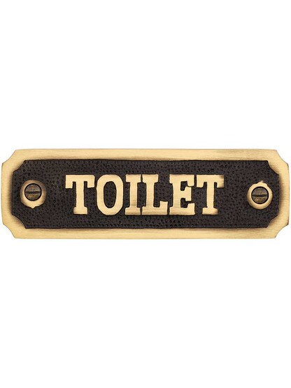 Cast Brass Toilet Sign in Antique Brass.